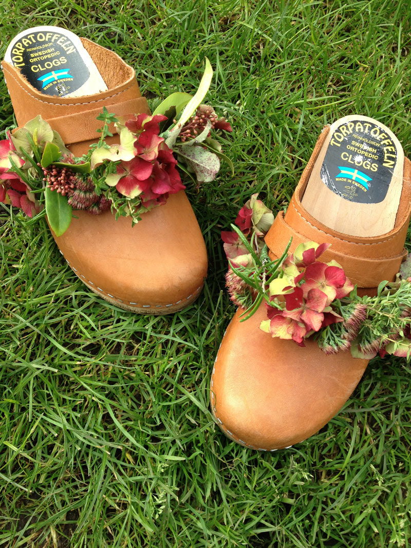 Swedish clogs decorated with garlands of Hydrangea, Sedum, thyme and rosemary