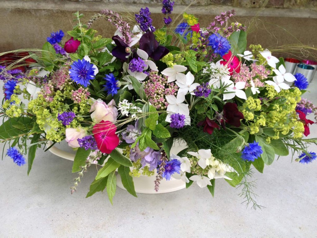 Cornflowers and sweet peas in a summer arrangement.